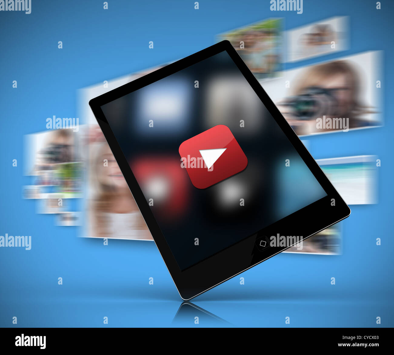 Tablet pc showing play button against blue background Stock Photo