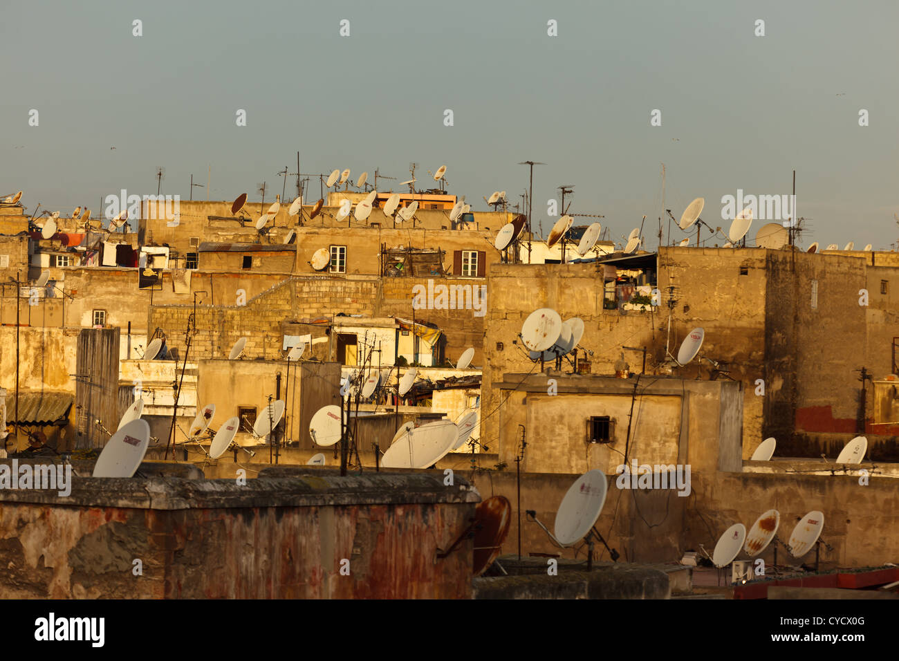 Roof tops of apartment houses with satellite dishes on top in the old quarter medina in the city Casablanca, Morocco. Stock Photo