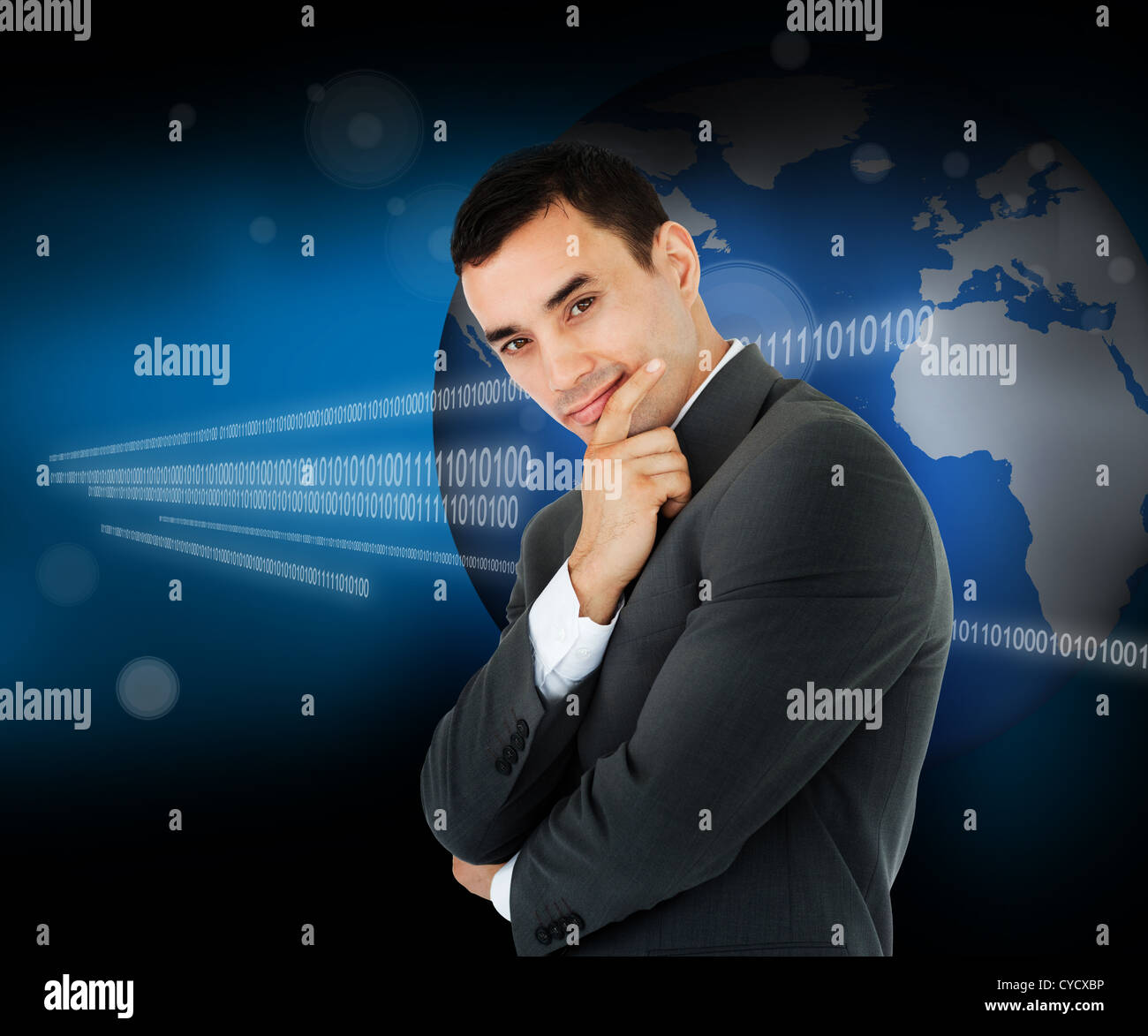 Businessman standing in front of a world map Stock Photo