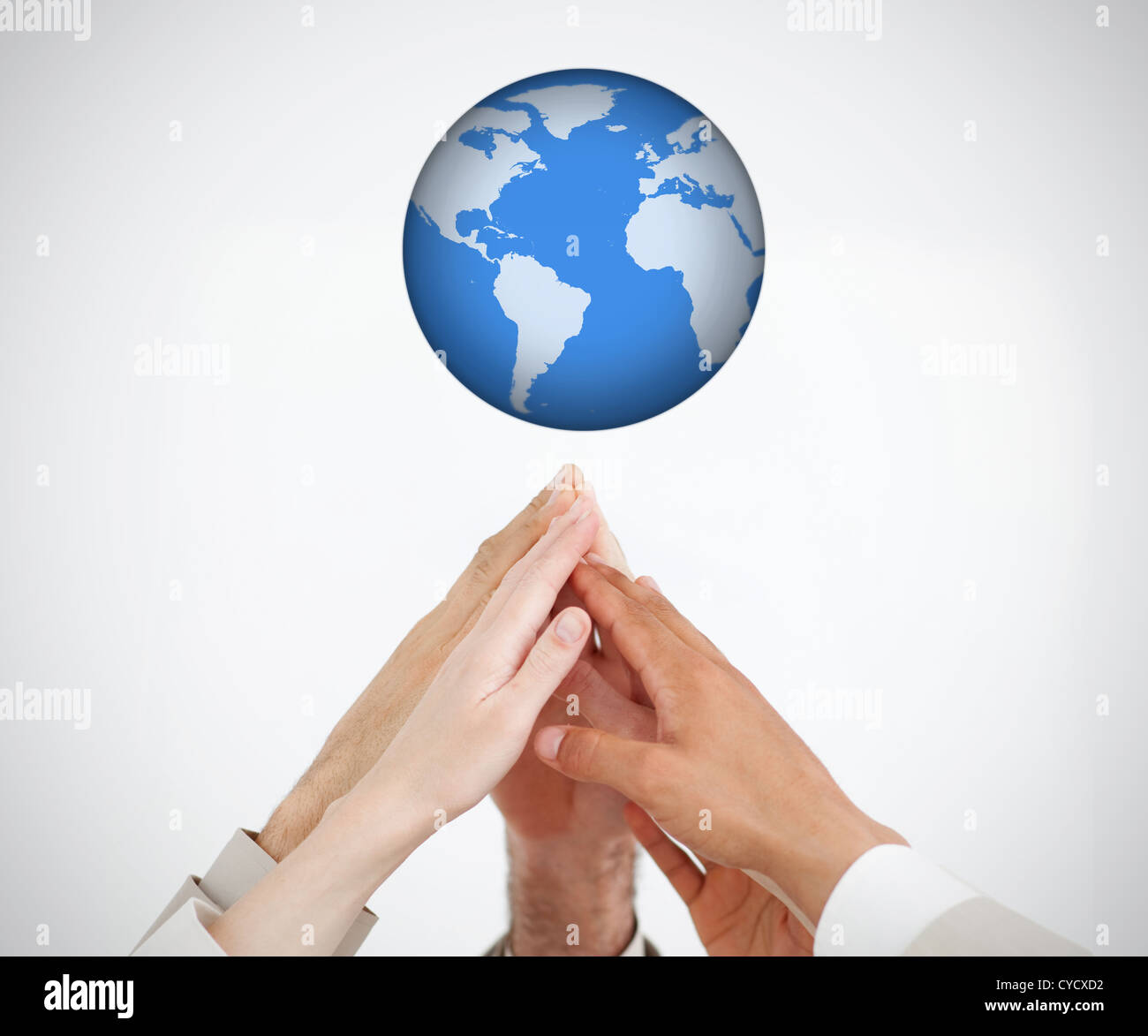 People reaching hands to globe Stock Photo