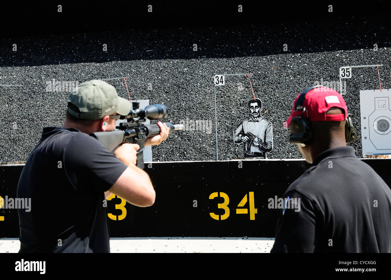 Gunman test firing automatic rifle at the FBI shooting range in Chicago