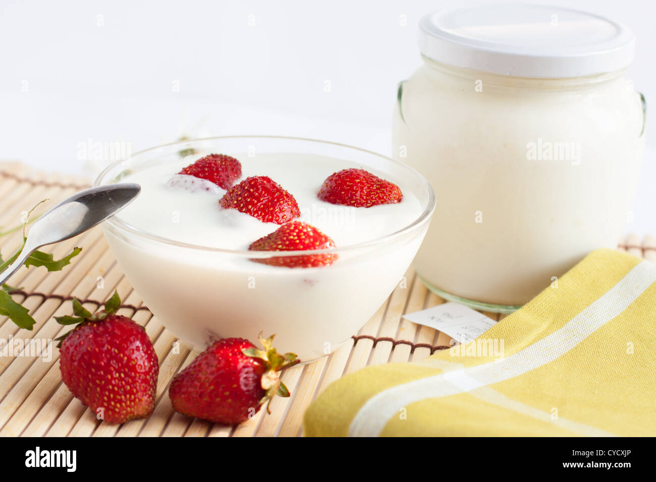 Strawberry yogurt in a bowl and the pot Stock Photo