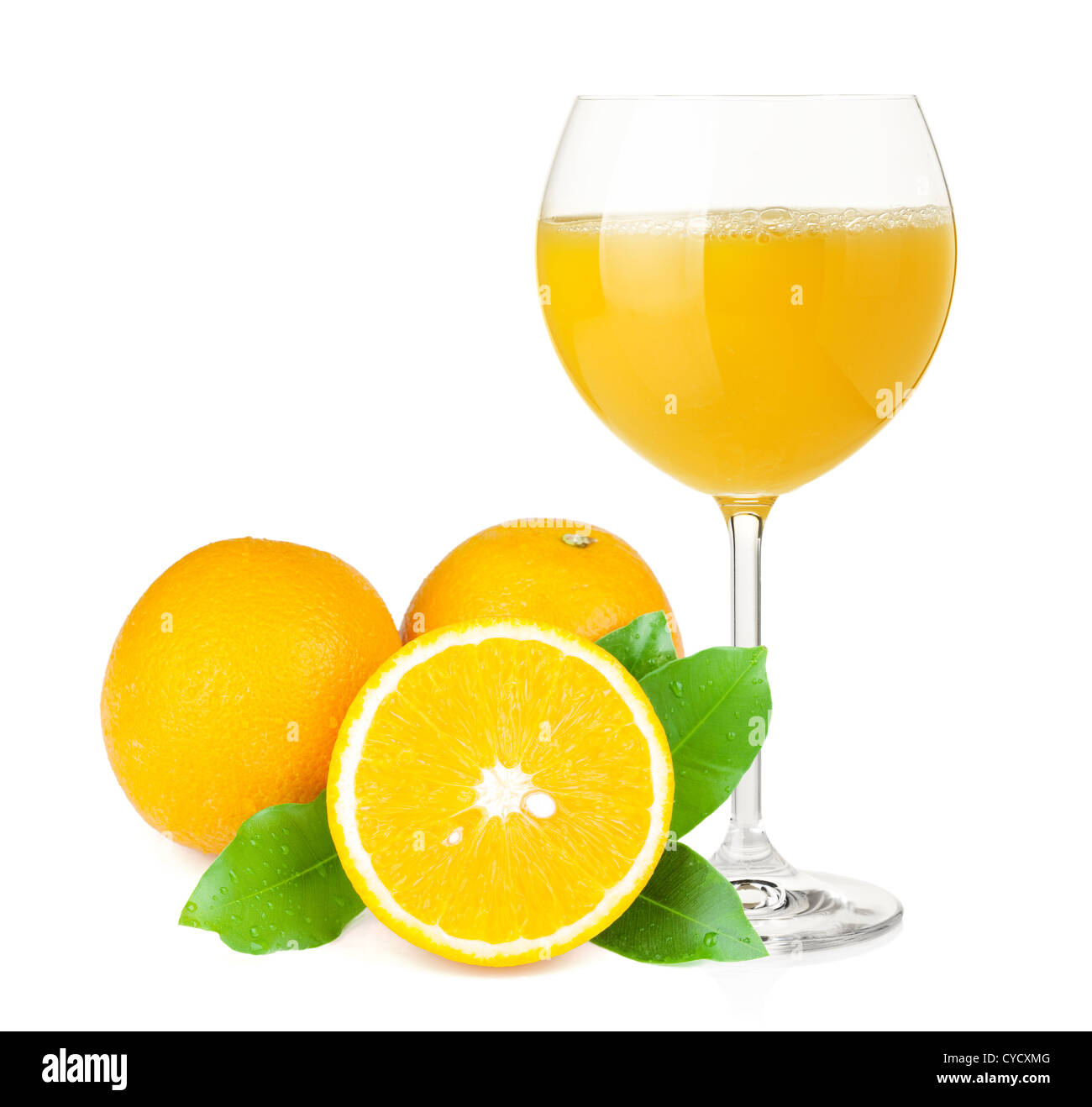 Orange juice in wine glass and oranges. Isolated on white background