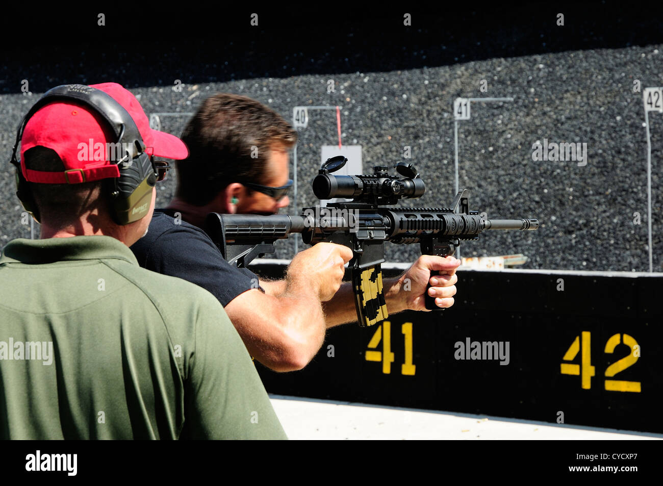 Gunman test firing automatic rifle at the FBI shooting range in Chicago