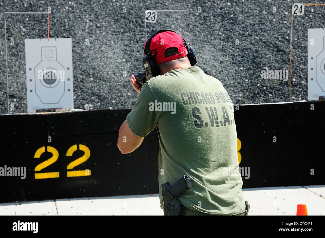 Gunman test firing automatic rifle at the FBI shooting range in Chicago