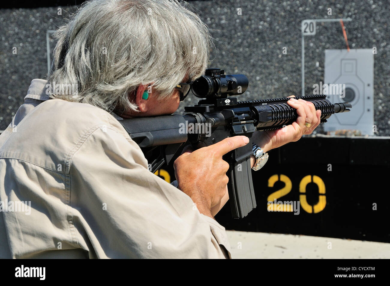Gunman test firing automatic rifle at the FBI shooting range in Chicago