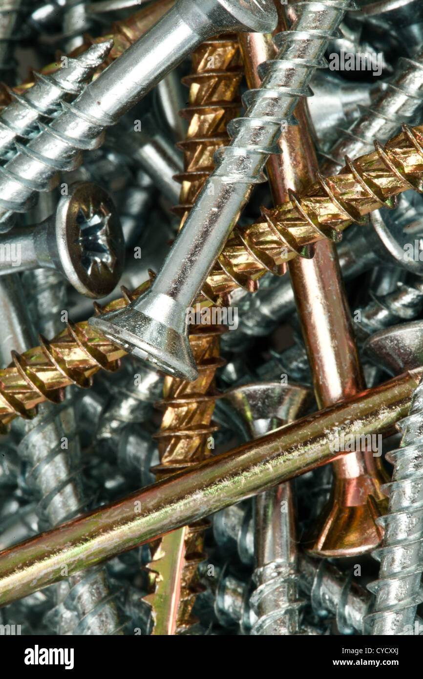 Golden and silver screws Stock Photo Alamy