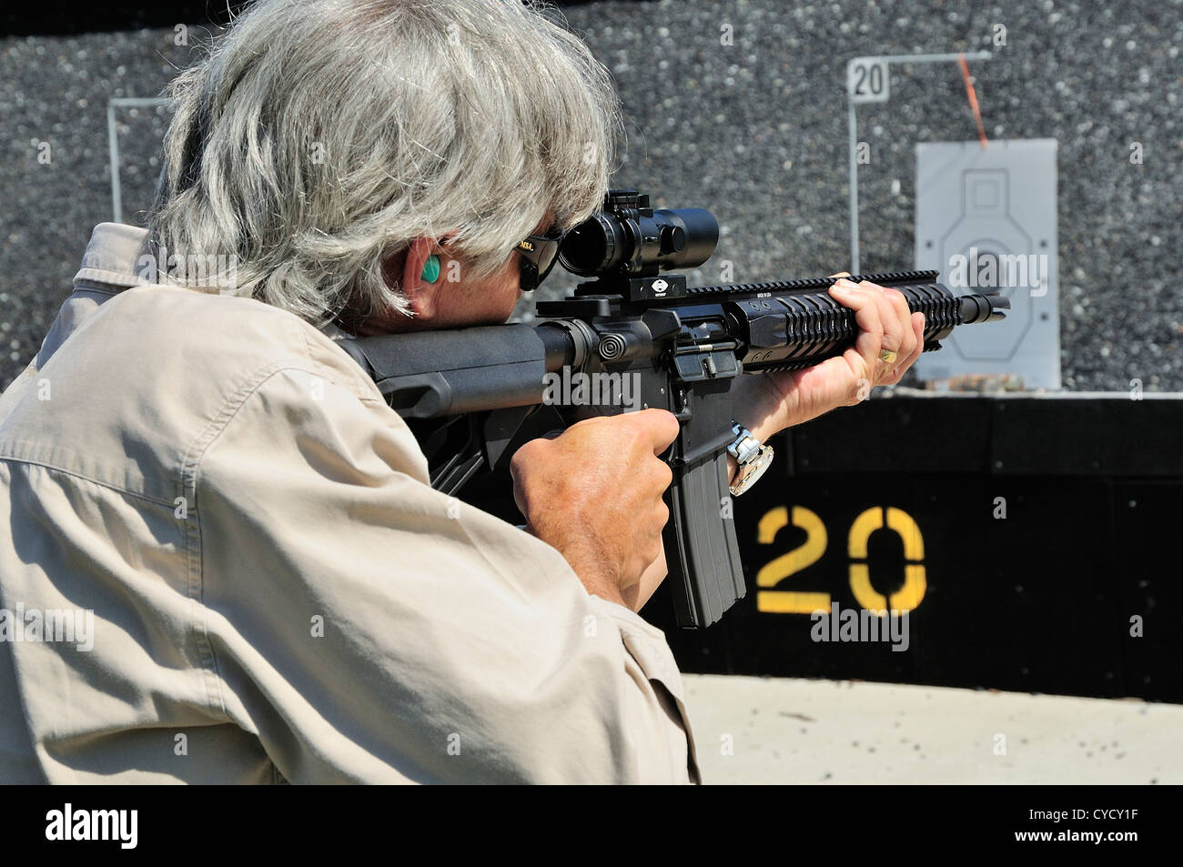 Gunman test firing automatic rifle at the FBI shooting range in Chicago