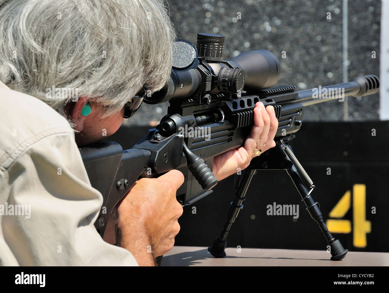 Gunman test firing .338 sniper rifle at the FBI shooting range in