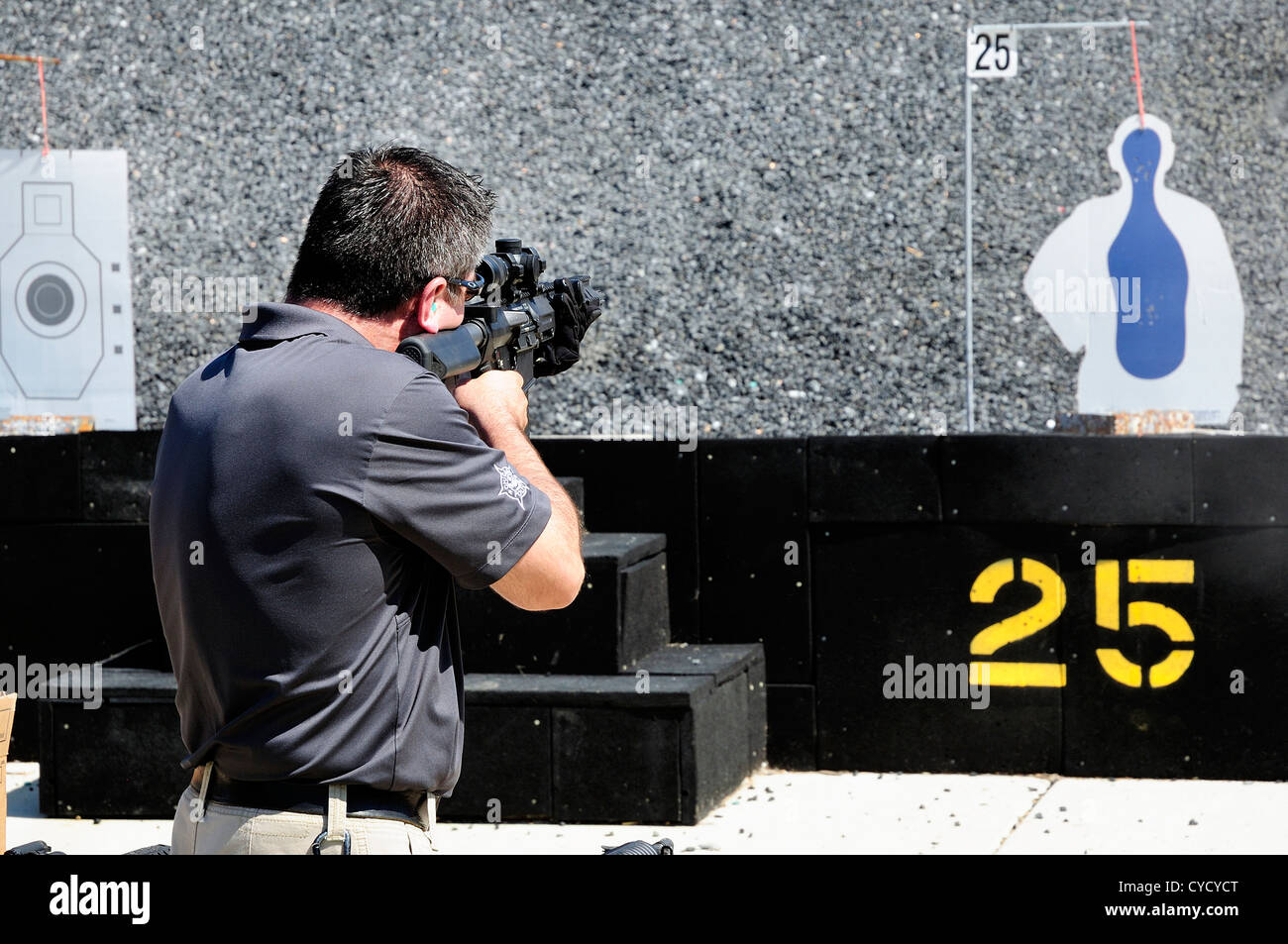 Gunman test firing automatic rifle at the FBI shooting range in Chicago
