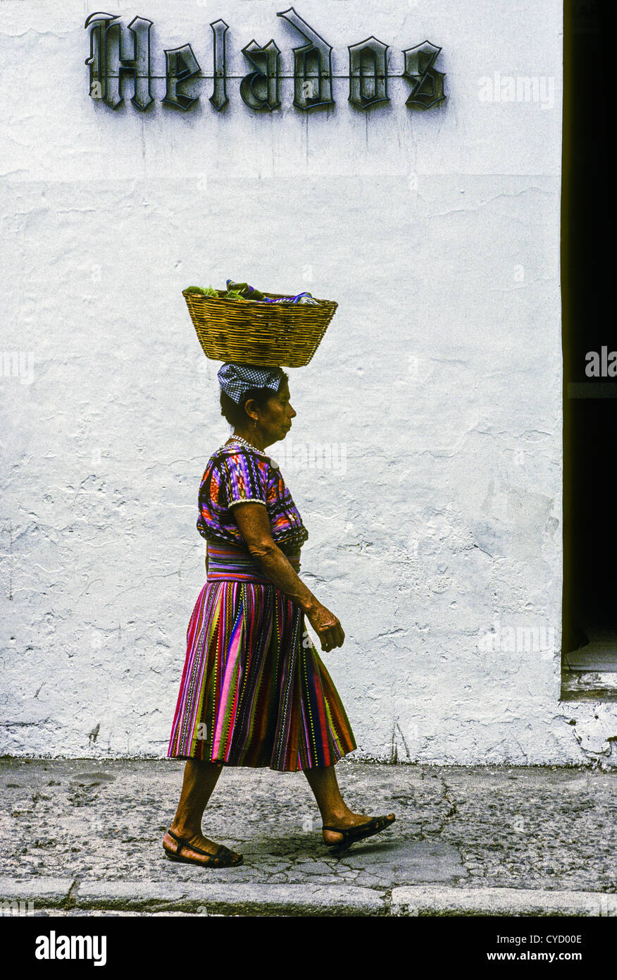 Guatemalan Quiche woman in traditional clothing headed to market with a