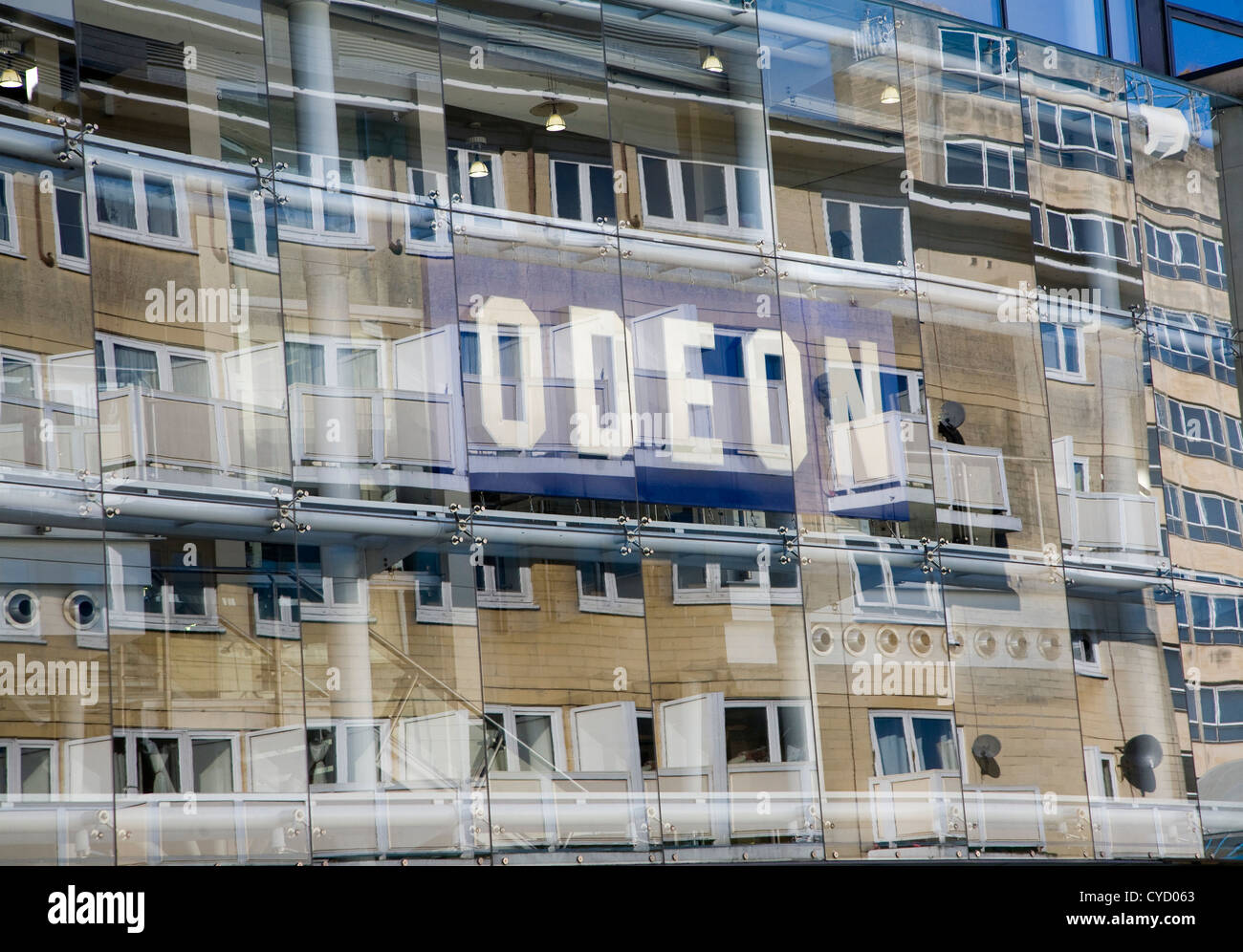 Reflection buildings glass front Odeon cinema, Bath, Somerset, England