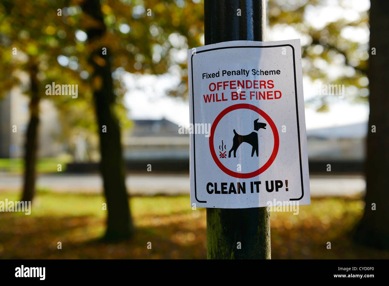 Park sign to clean it up after your dog Stock Photo