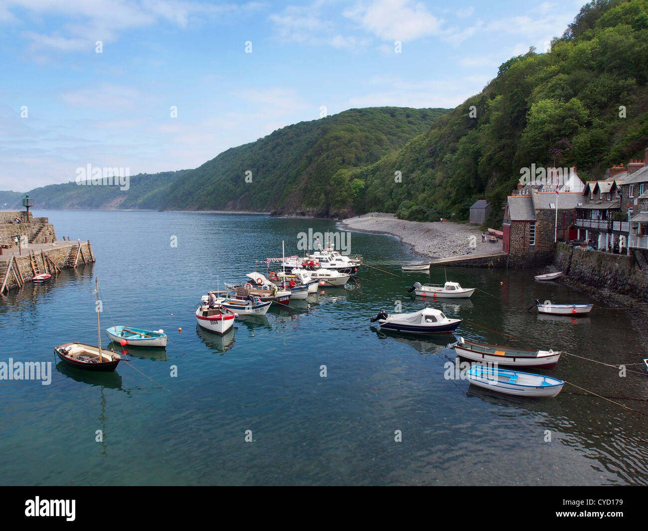 Clovelly harbour with boats and blue sky Stock Photo