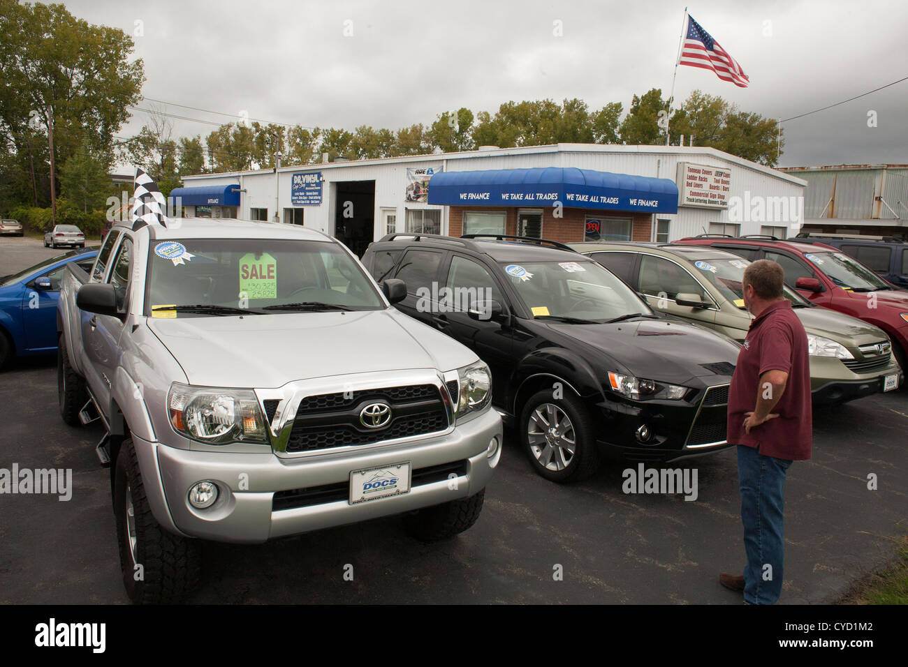 A car salesman looks over his stock in Pittsfield Massachusetts. Stock Photo
