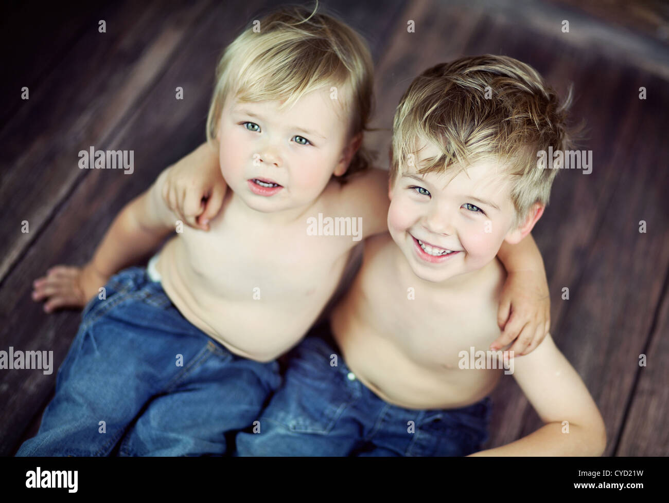 Two little boys on the floor Stock Photo Alamy