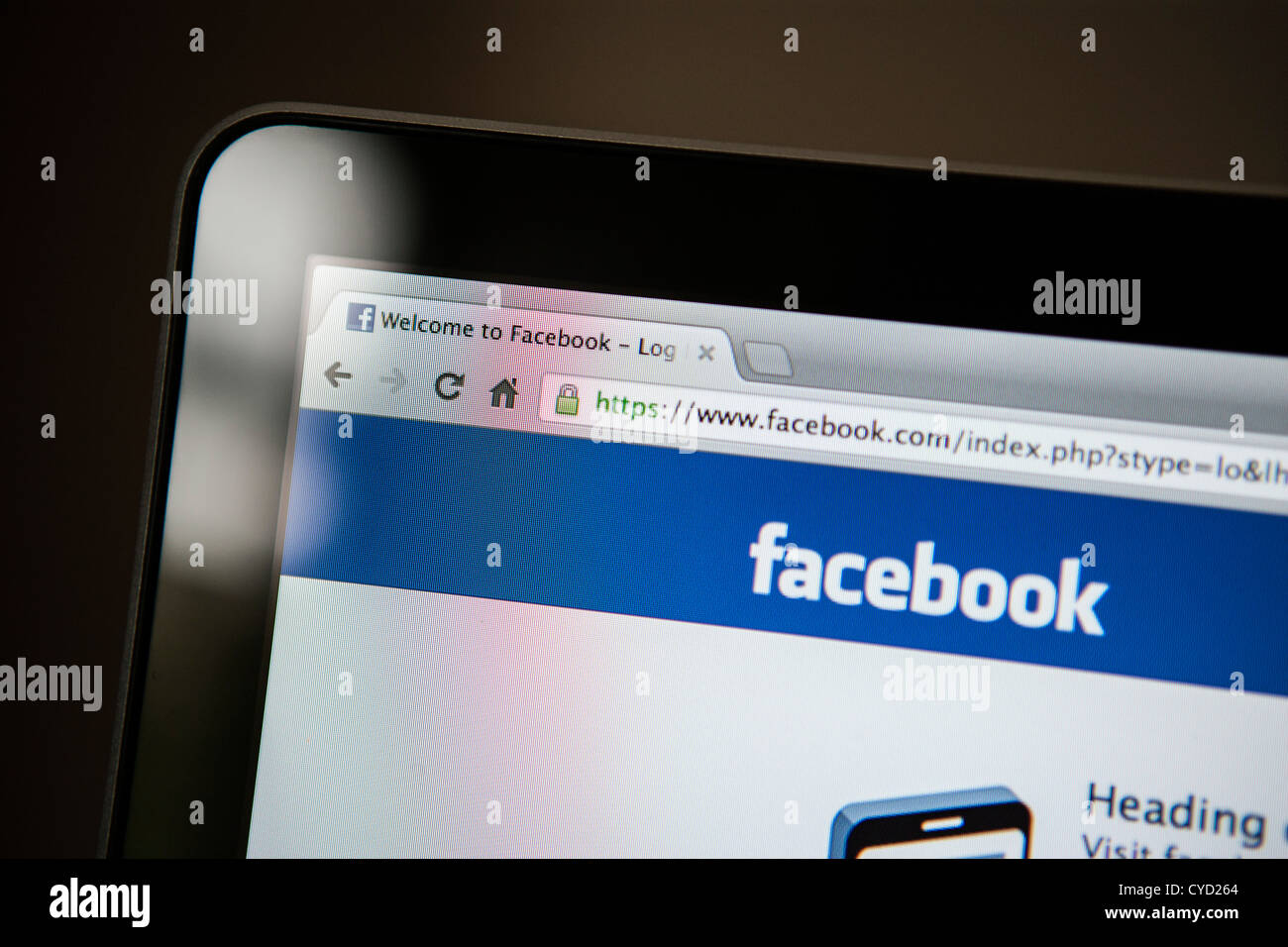 The login page of Facebook shown on a laptop screen. Stock Photo