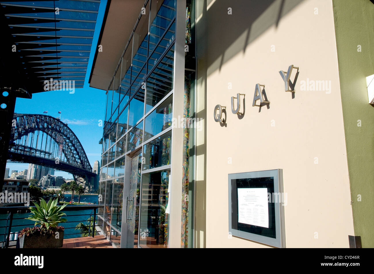 Facade of Quay Restaurant, Australia's most awarded restaurant Circular Quay, Sydney and the iconic Sydney Harbour Bridge behind - Australia Stock Photo