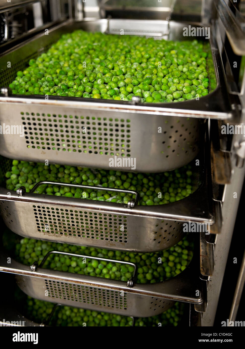 frozen peas in the steamer Stock Photo