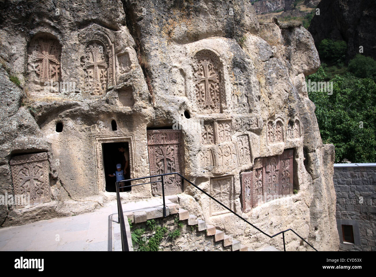 khatchkars-and-entrance-to-a-monastic-cell-at-geghard-monastery-armenia-CYD53X.jpg