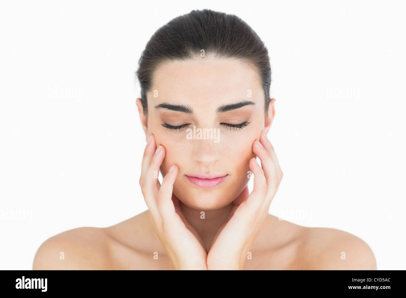 Woman touching her chin while looking natural Stock Photo