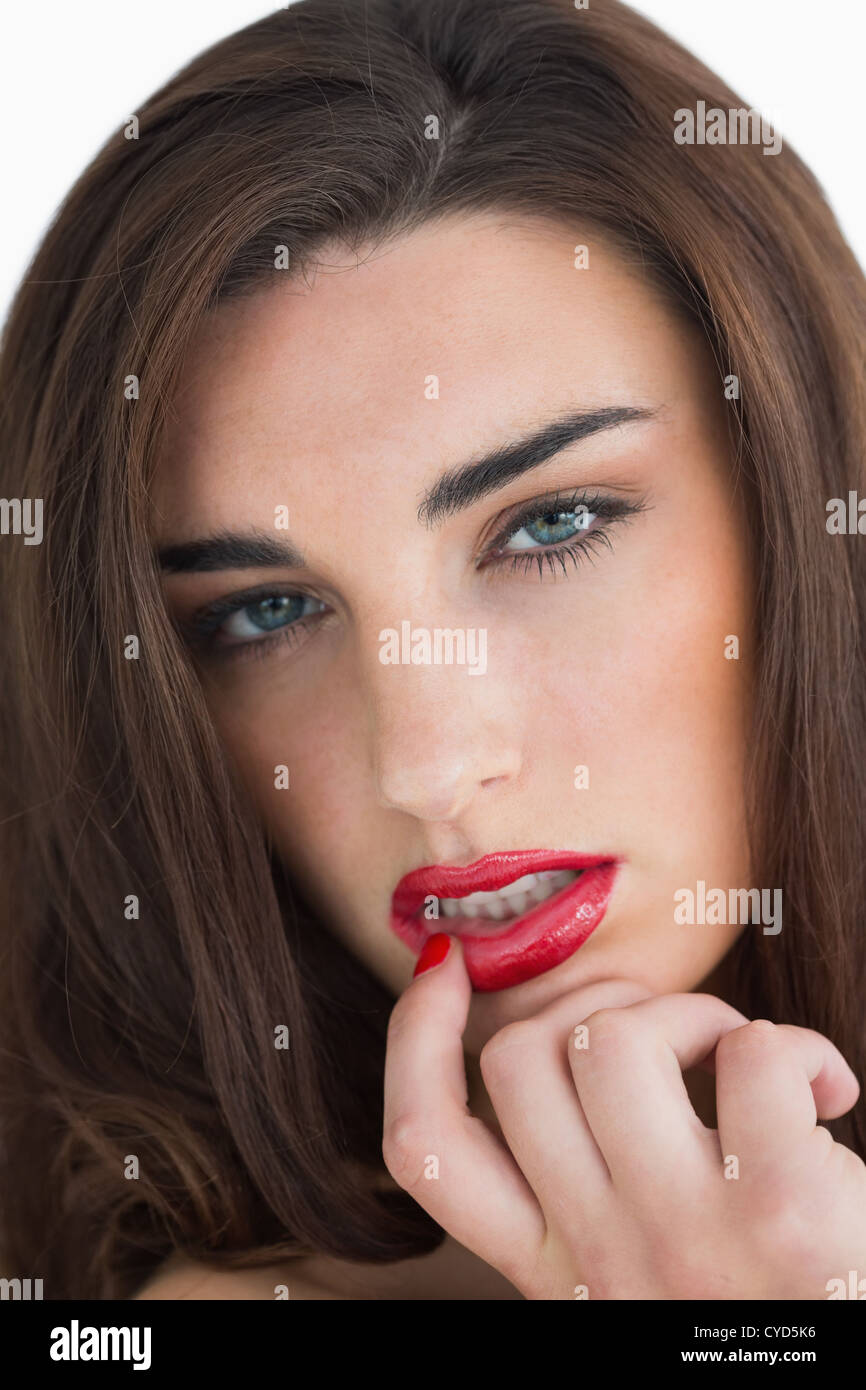 Woman touching her red lips Stock Photo