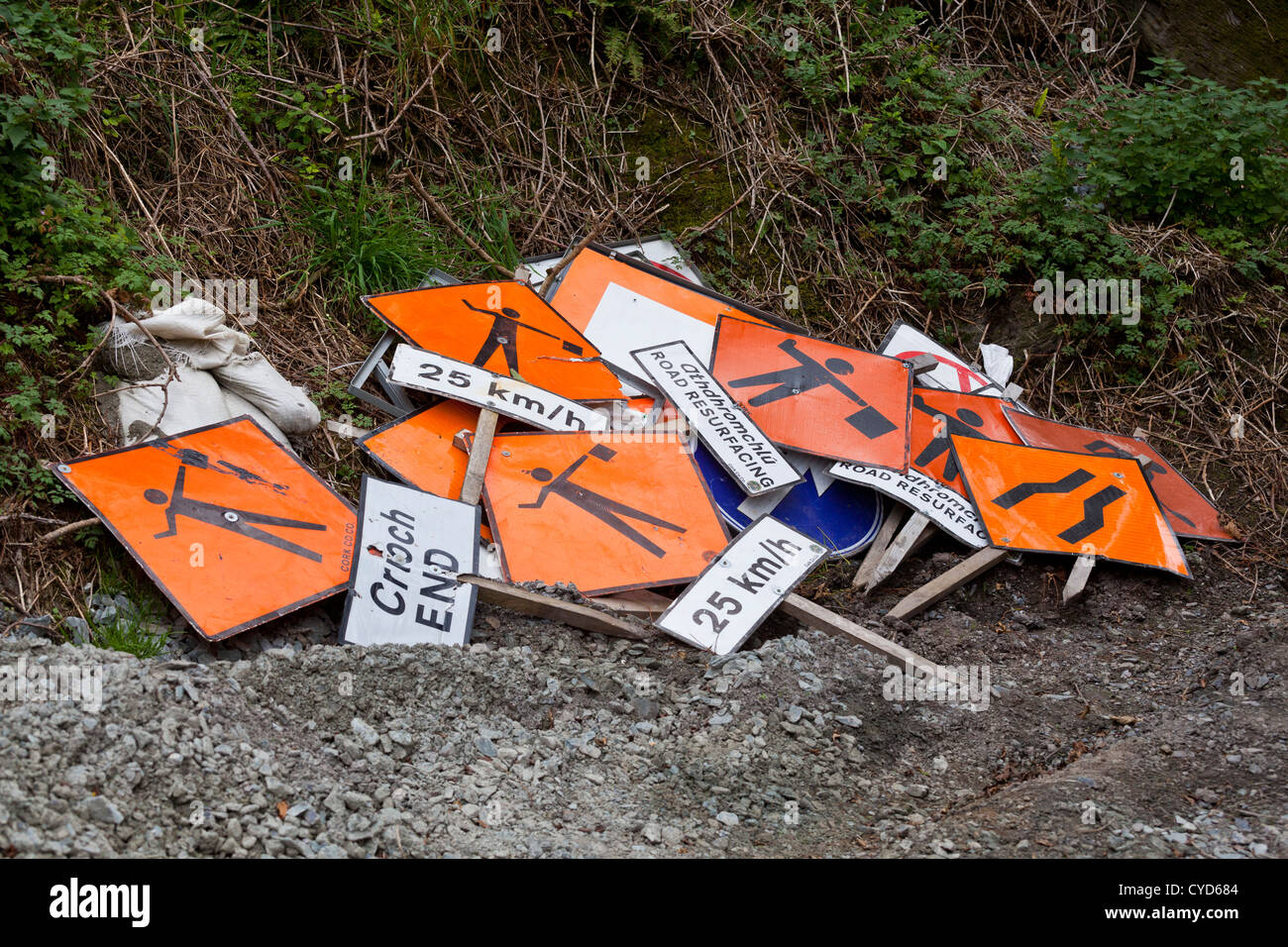 Roadworks signs piled up on the side of a road in West Cork, Ireland Stock Photo