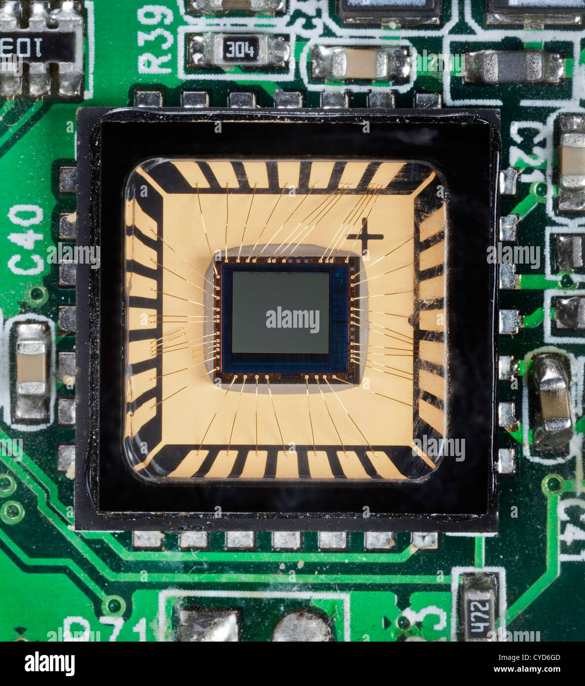 Tiny cmos chip on ic board with connecting wires from a webcam camera, Stock Photo