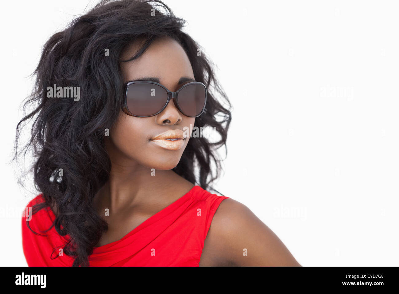 Woman wearing sunglasses and a red dress Stock Photo