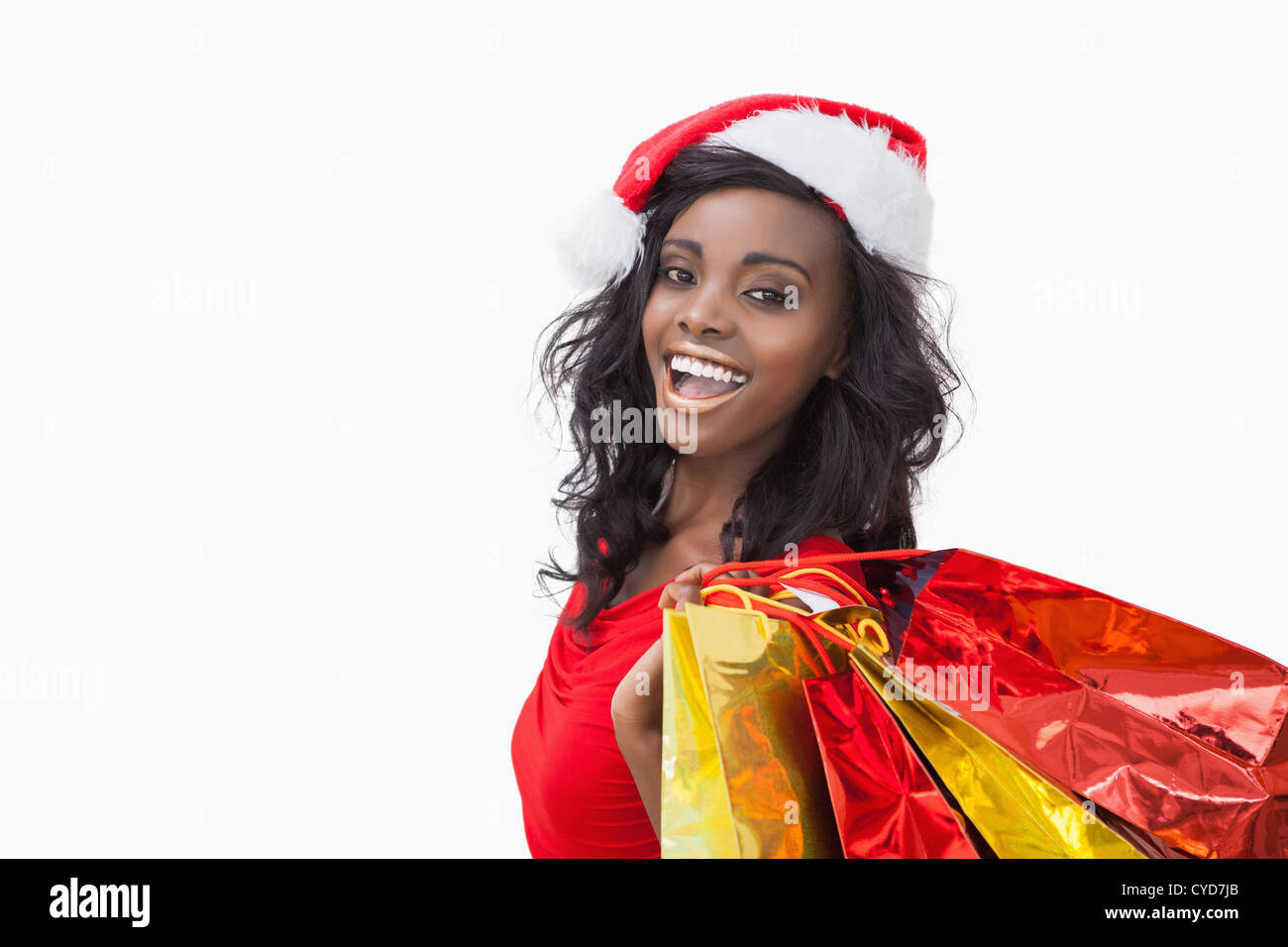 Woman standing while holding bags Stock Photo