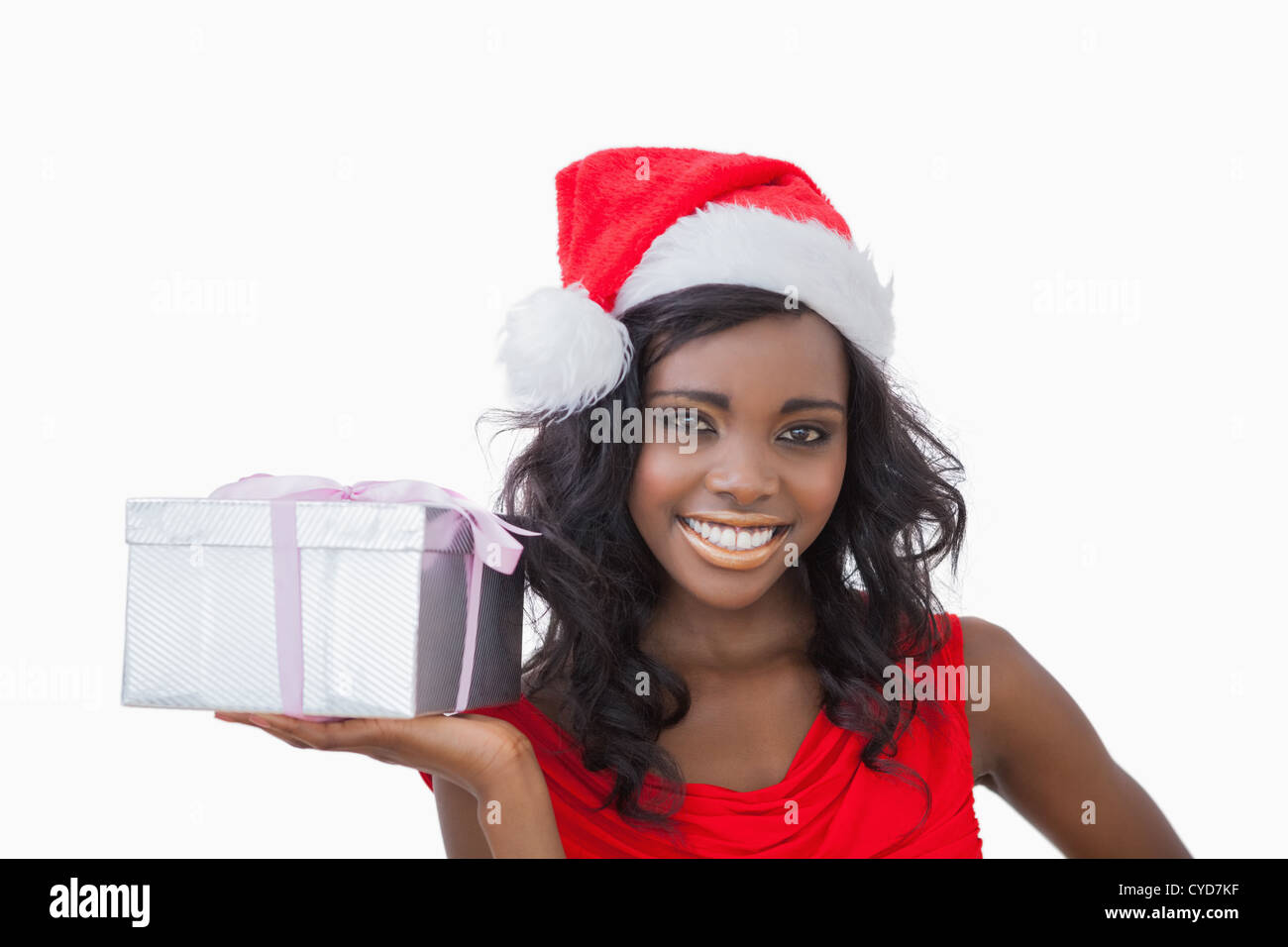 Woman standing holding a Christmas present Stock Photo