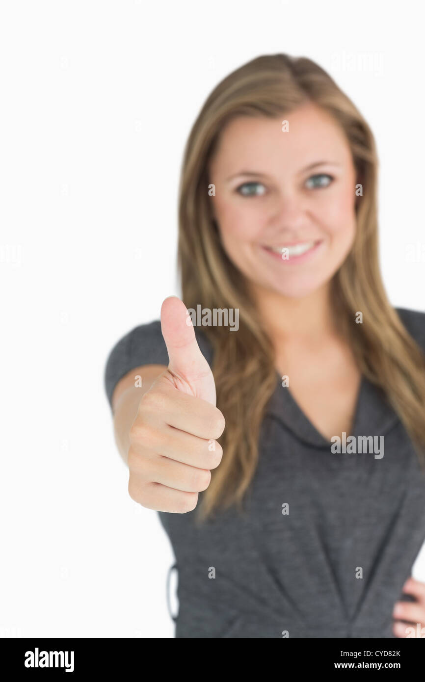 Woman giving thumbs up Stock Photo