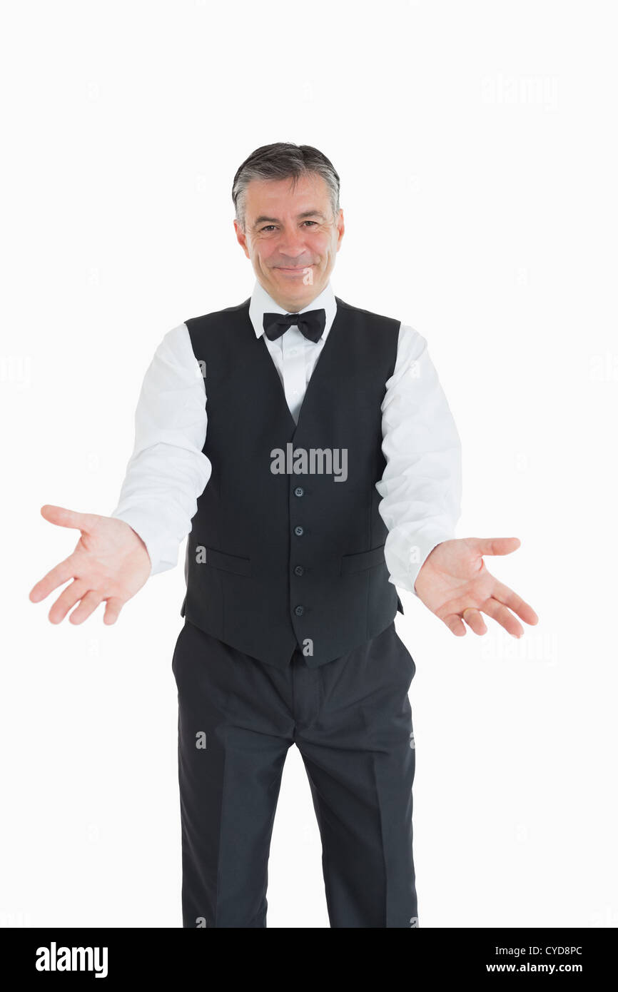 Waiter with open arms Stock Photo
