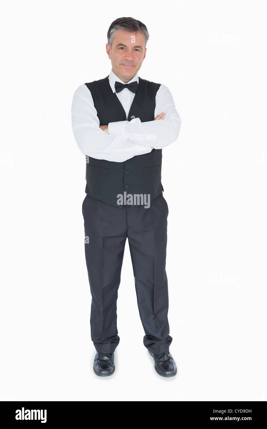 Waiter with crossed arms Stock Photo