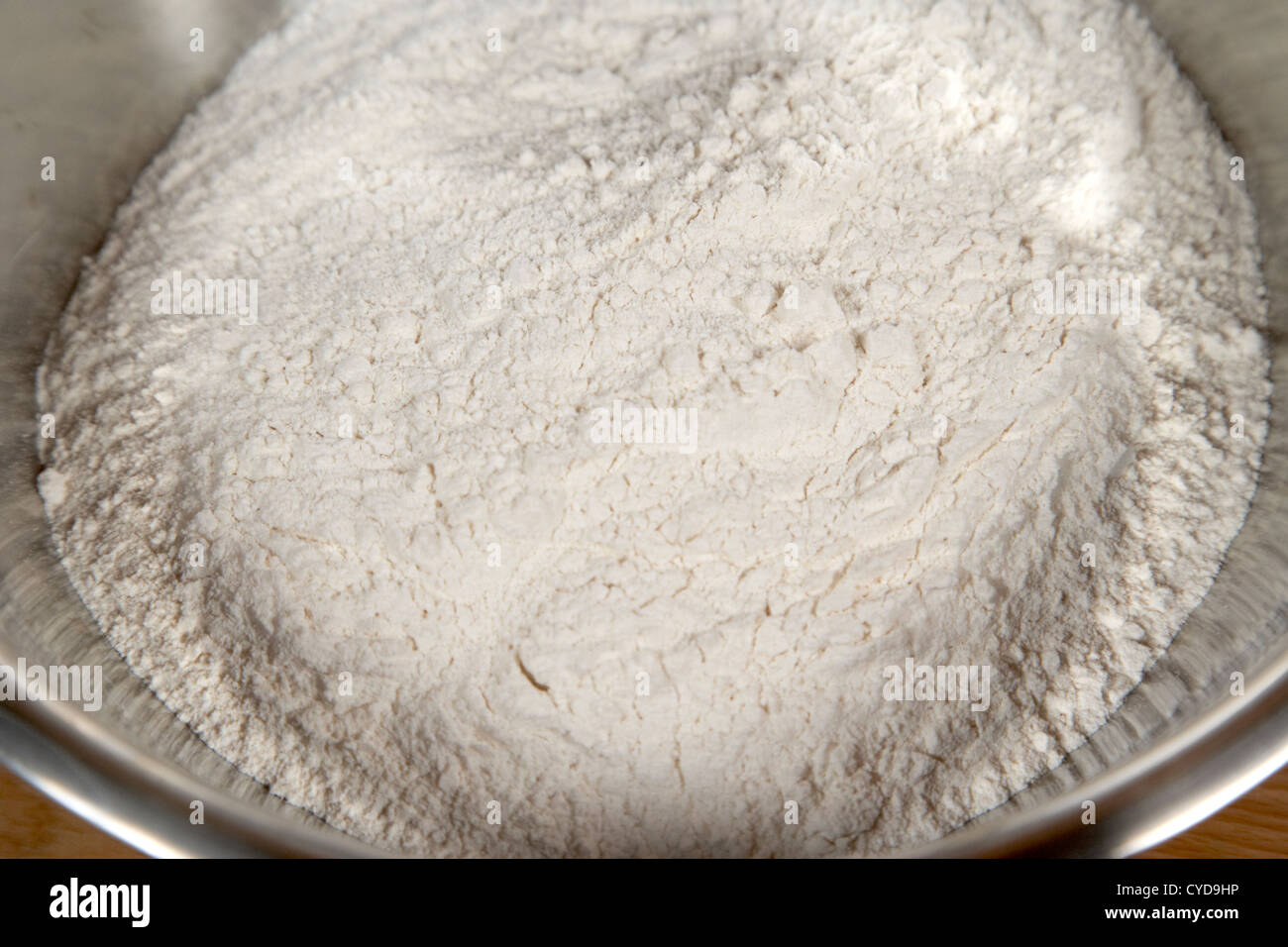 plain flour in a metal bowl for baking Stock Photo
