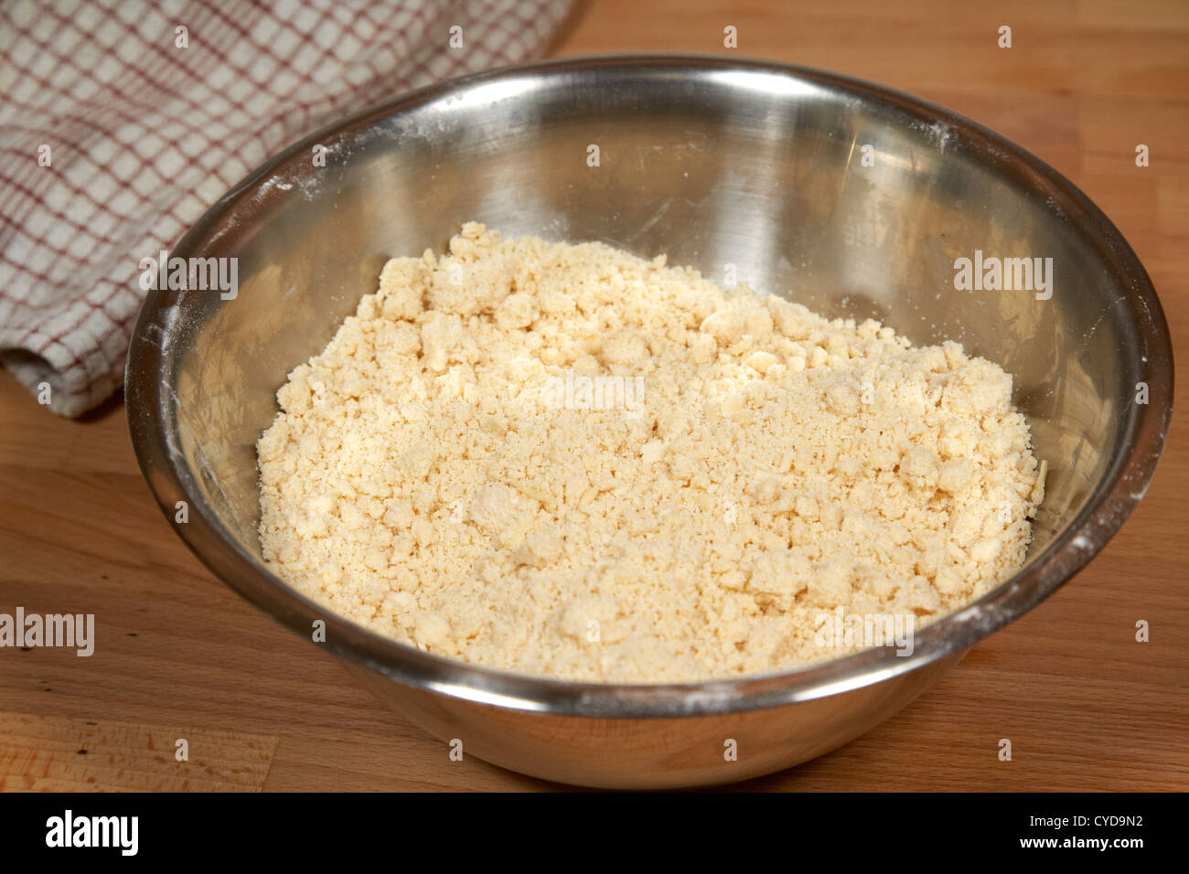 flour and butter mixed together as the basis for shortcrust pastry in a metal bowl Stock Photo