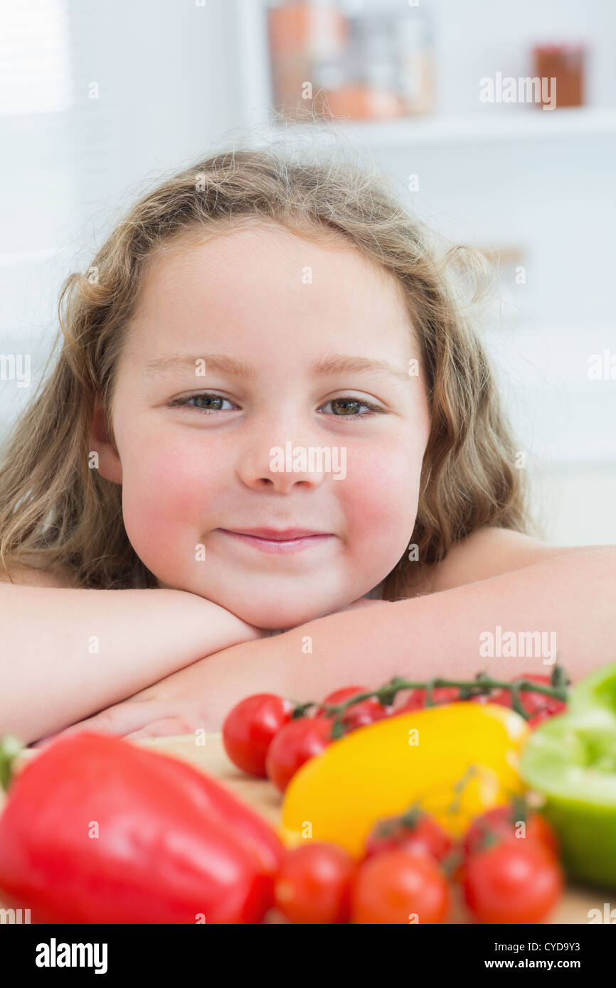 Close up of girl leaning on table Stock Photo