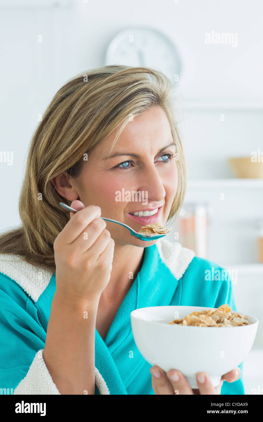 Woman eating cereal Stock Photo Alamy