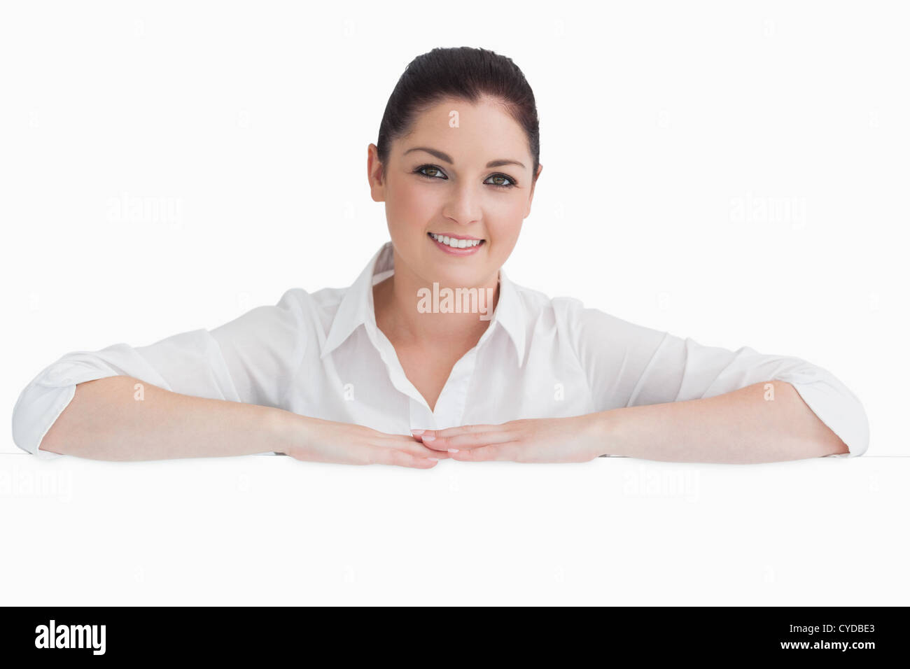Smiling woman resting on arms Stock Photo