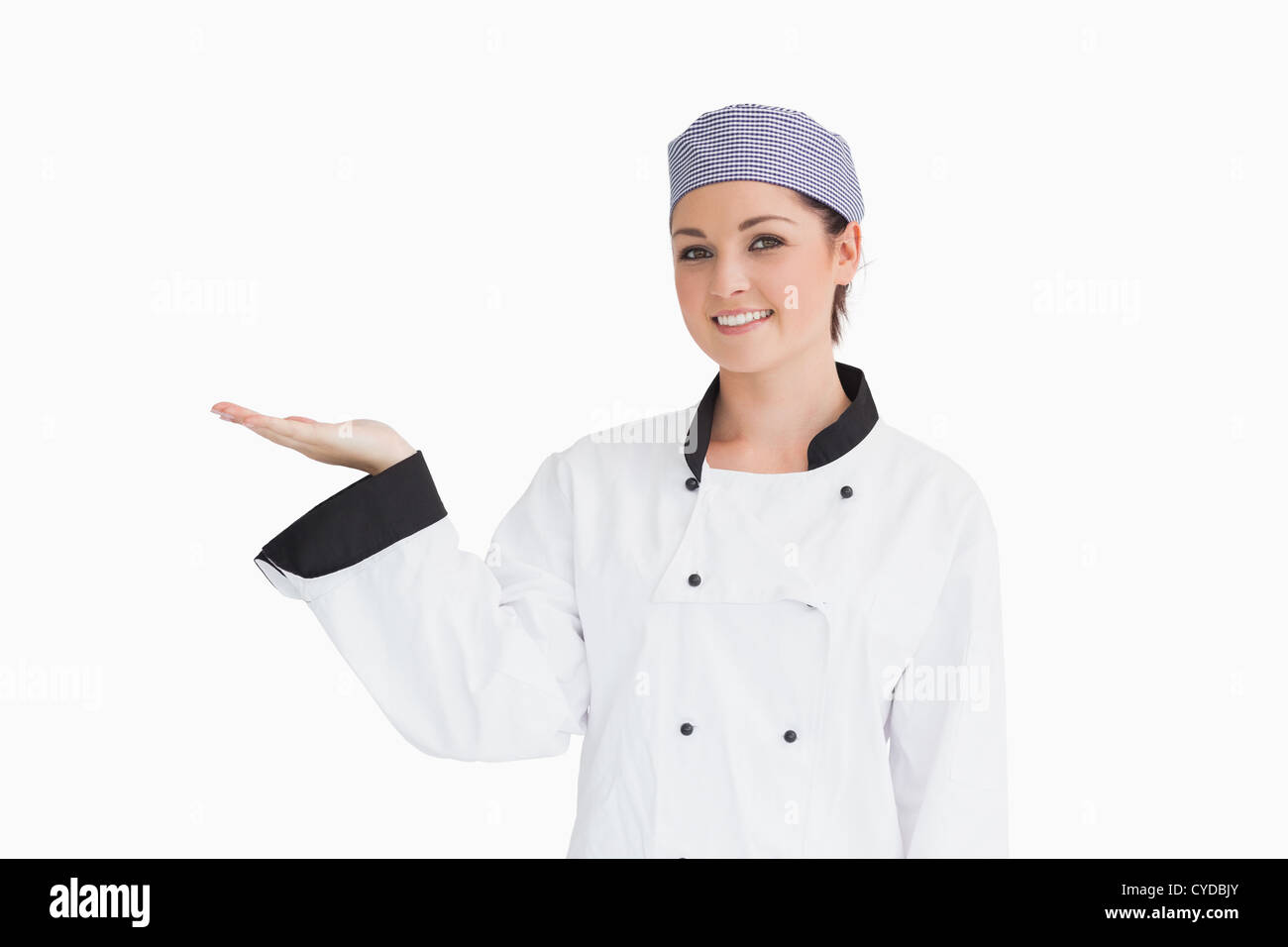 Chef holding out hand in presentation Stock Photo