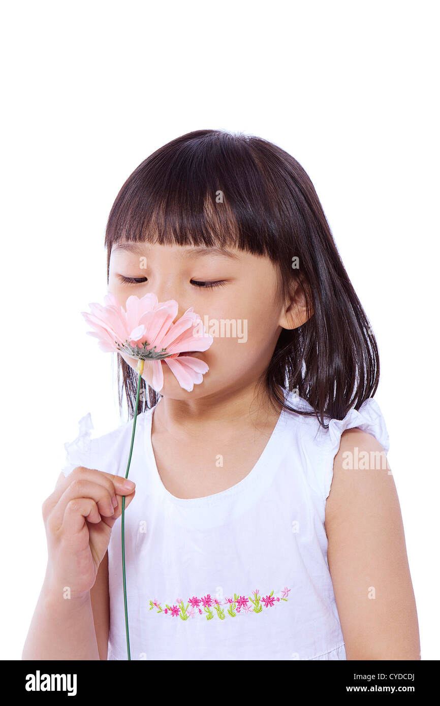 A little girl smelling flower,portrait Stock Photo - Alamy