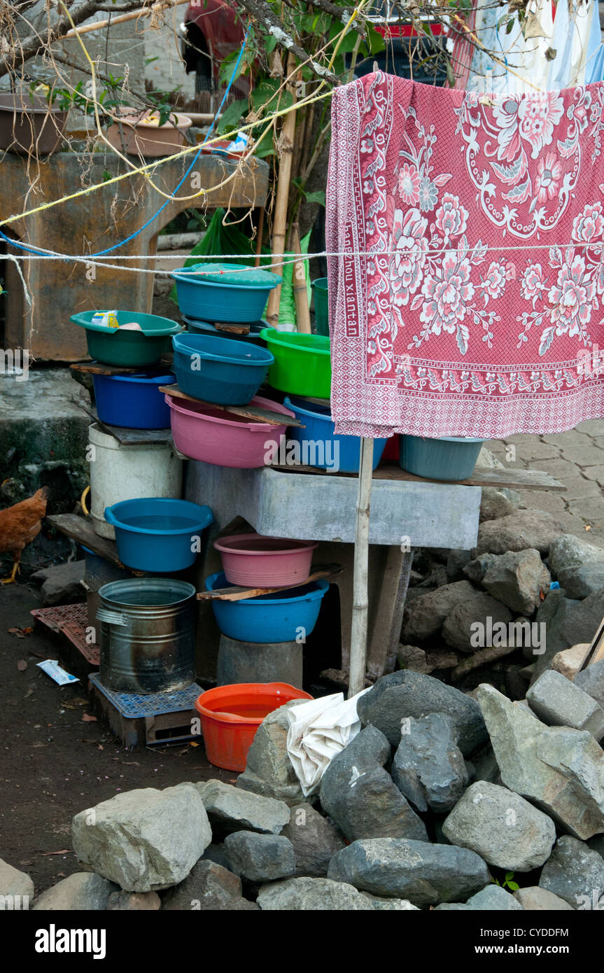 Plastic buckets with water in an impoverished village without running water Solola department Guatemala Stock Photo