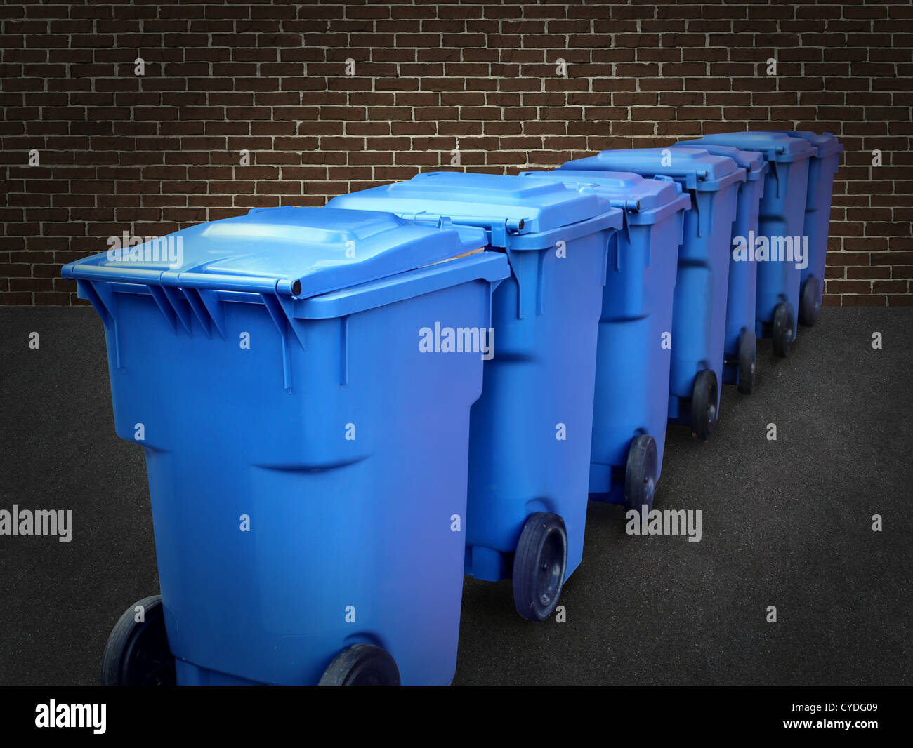 Recycle bins in a group made of commercial size blue plastic containers
