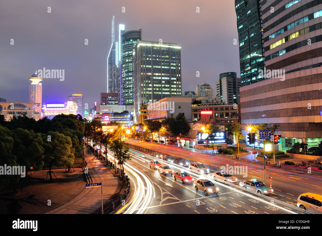 Shanghai street view with urban scene and busy traffic at dusk Stock ...