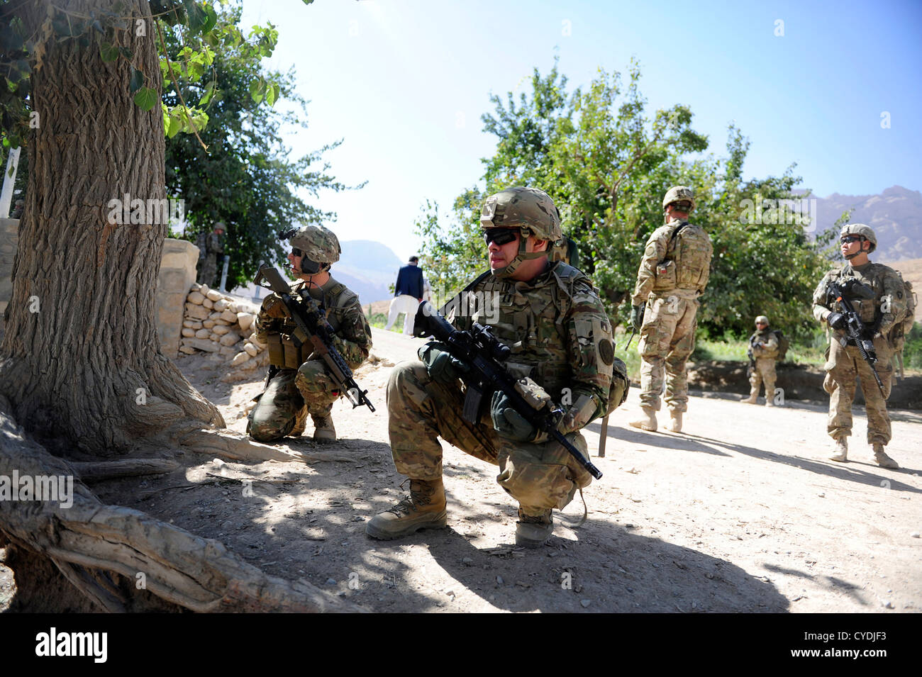 US soldiers patrol a village September 26, 2012 in Pur Chaman district, Farah province, Afghanistan. The Provincial Reconstruction Team Farah marks the first time coalition forces have been to the Pur Chaman district in over a year. Stock Photo