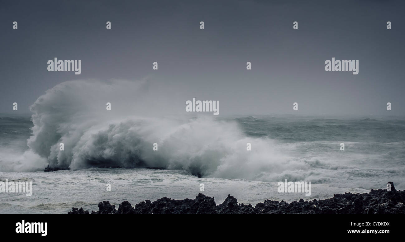 Typhoon strikes the coast of Okinawa Japan producing large waves Stock Photo