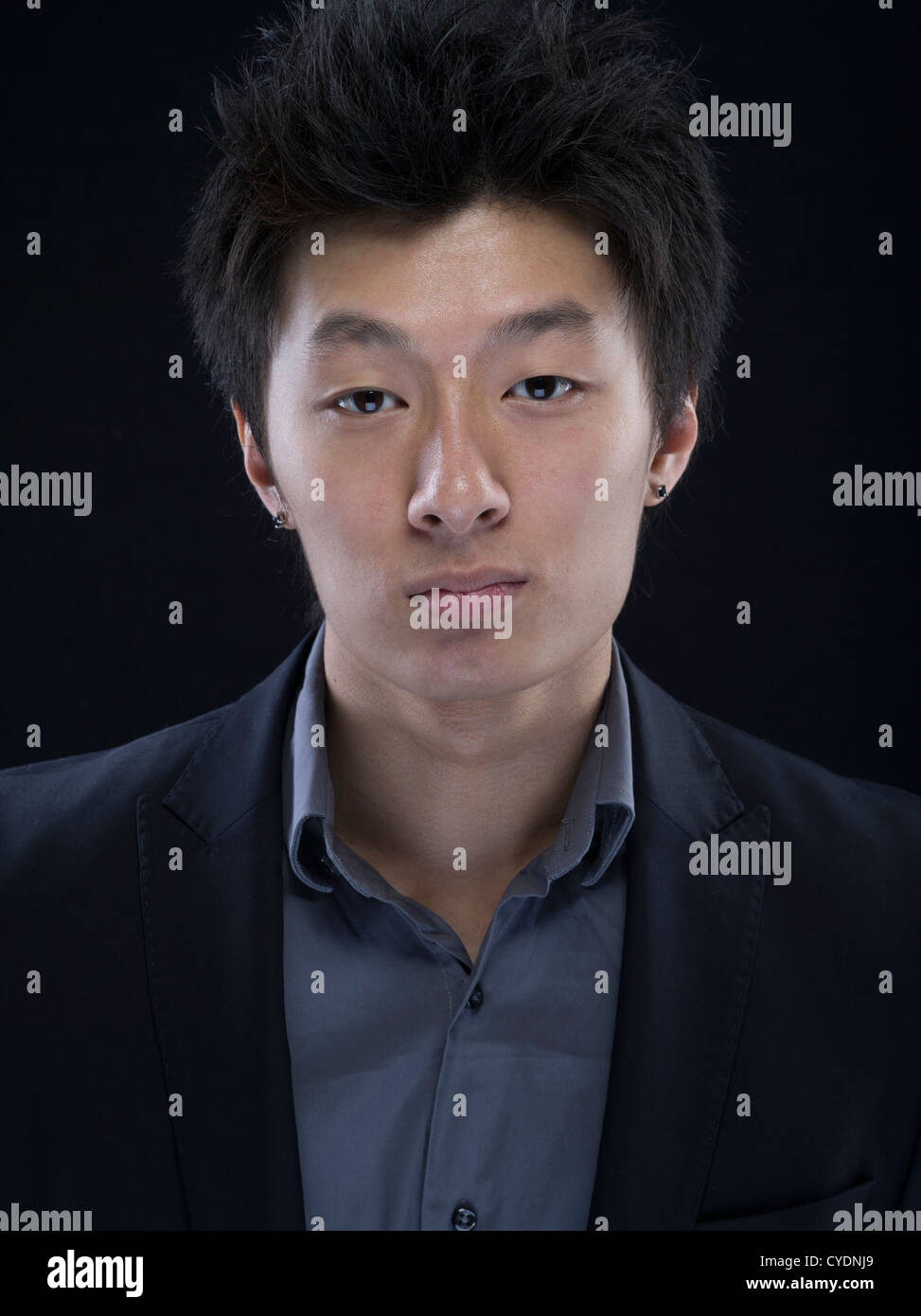 Young asian male in suit and grey shirt Stock Photo Alamy
