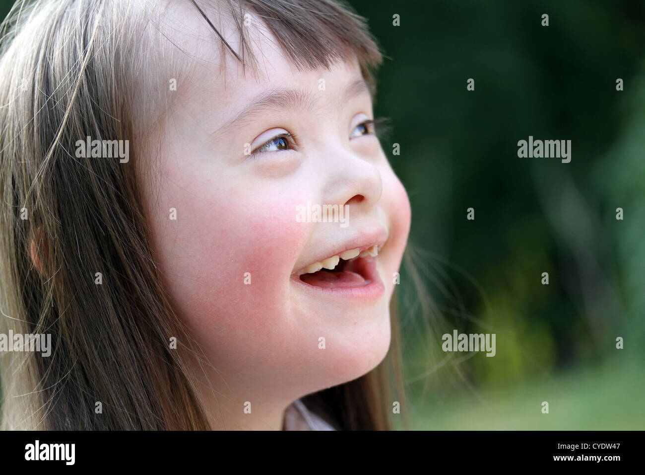 Portrait of beautiful young girl on the green background Stock Photo ...