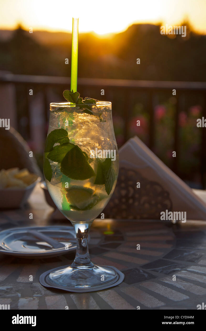 https://c8.alamy.com/comp/CYDX4M/a-delicious-mojito-cocktail-on-a-sardinian-terrace-at-sunset-CYDX4M.jpg