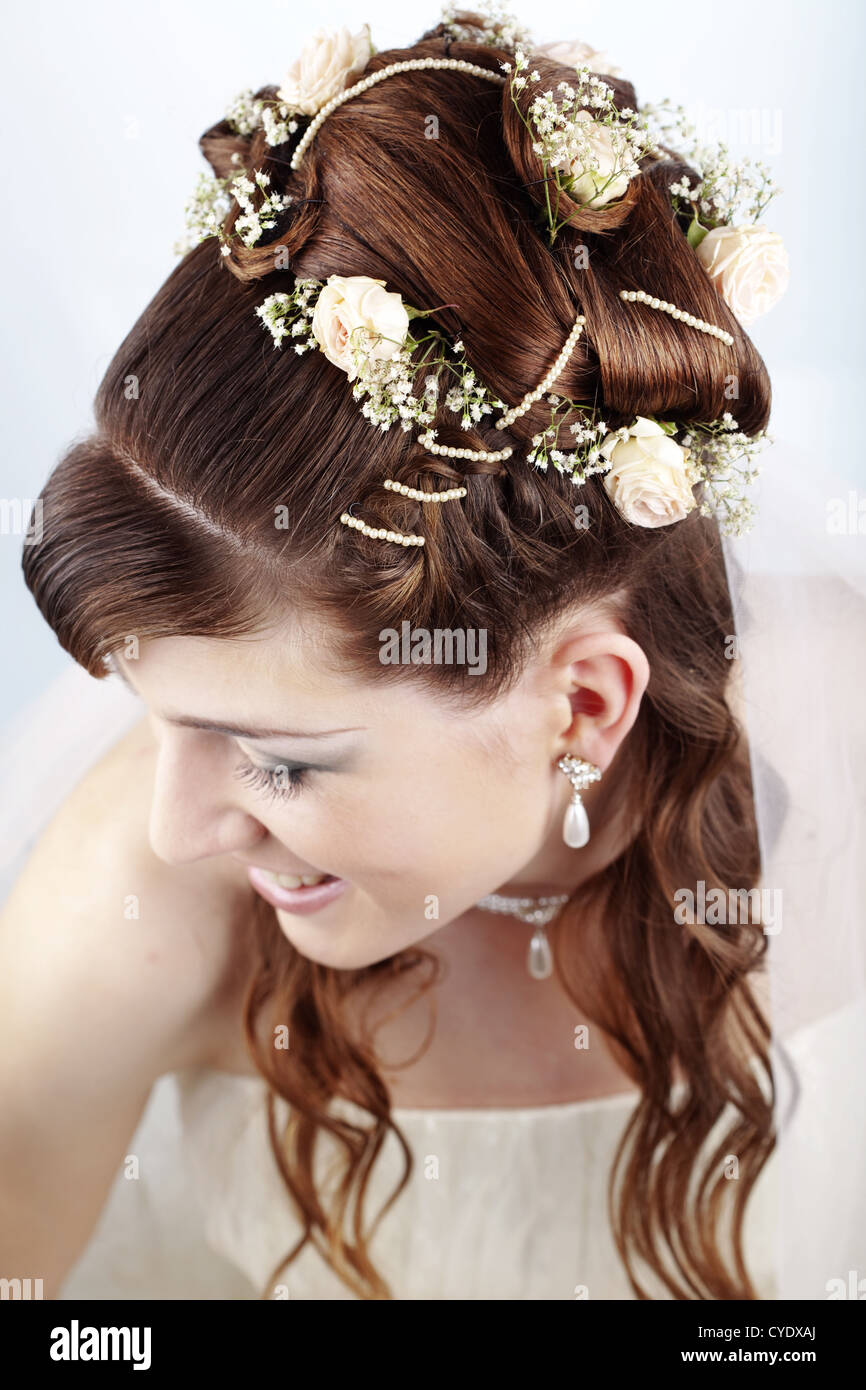 Fashion bridal hairstyle with floral decoration Stock Photo